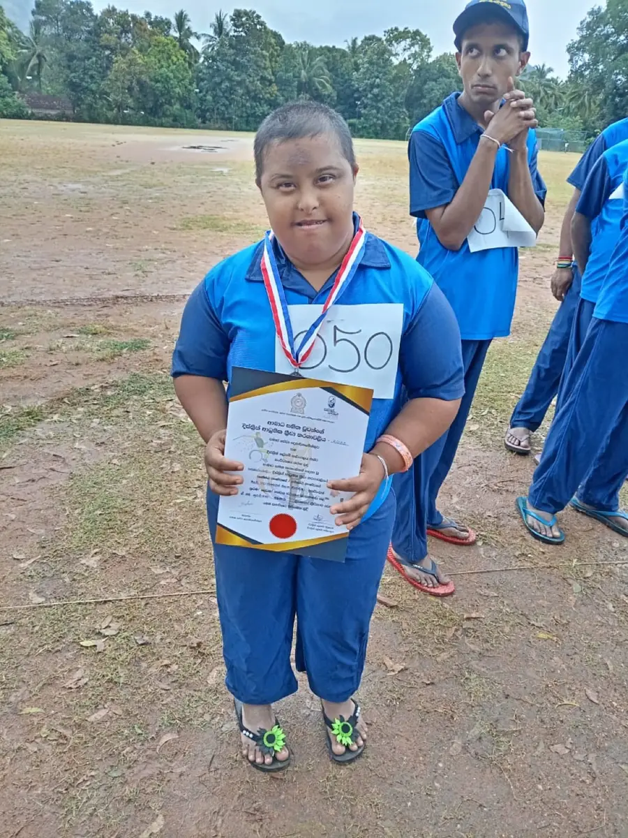Child with sports achievement medal